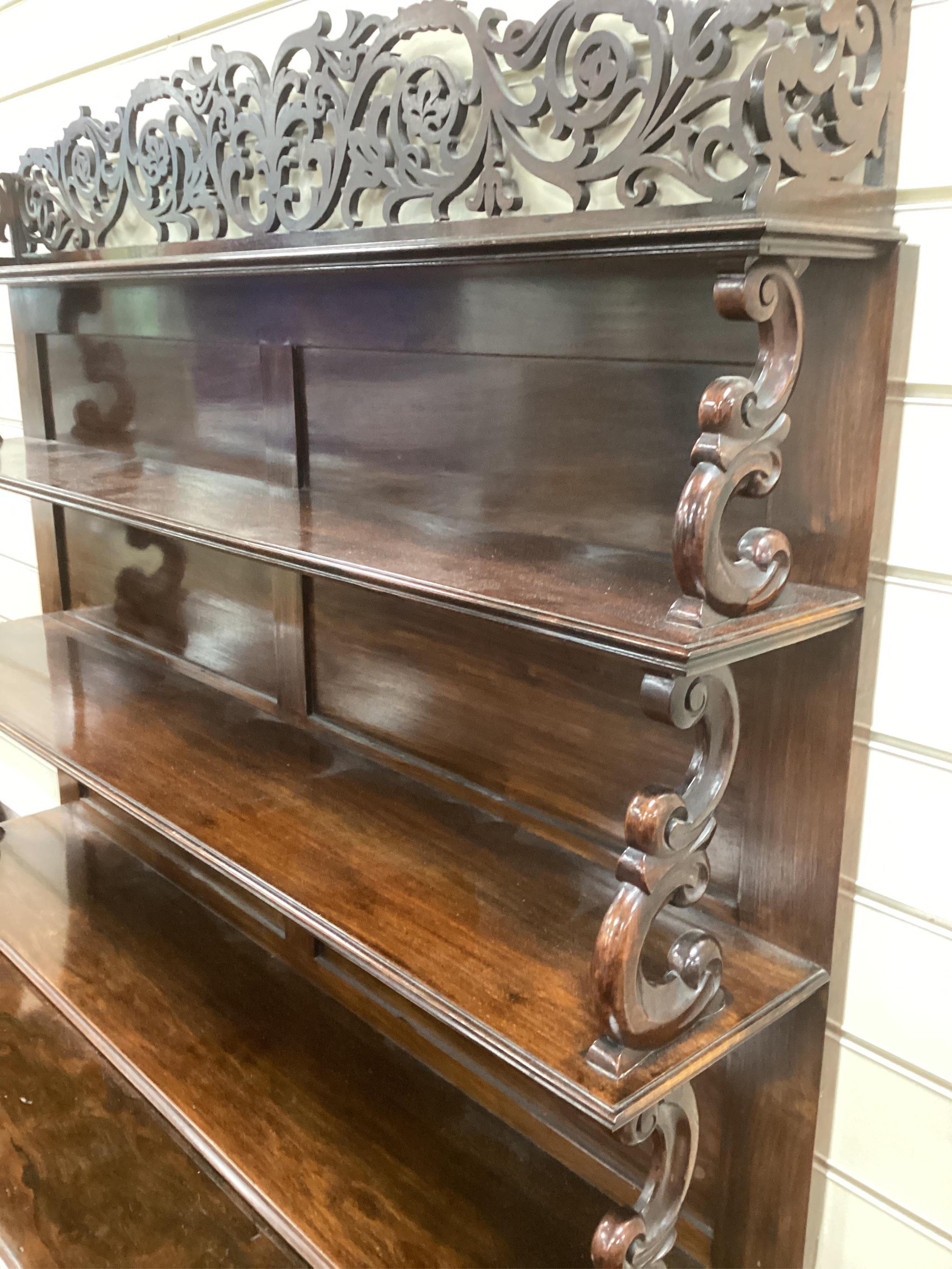 An early Victorian rosewood chiffonier, possibly Irish, width 122cm, depth 40cm, height 180cm. Condition - good